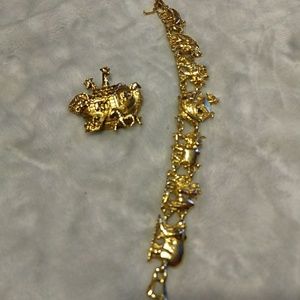 Gold tone brooch and bracelet